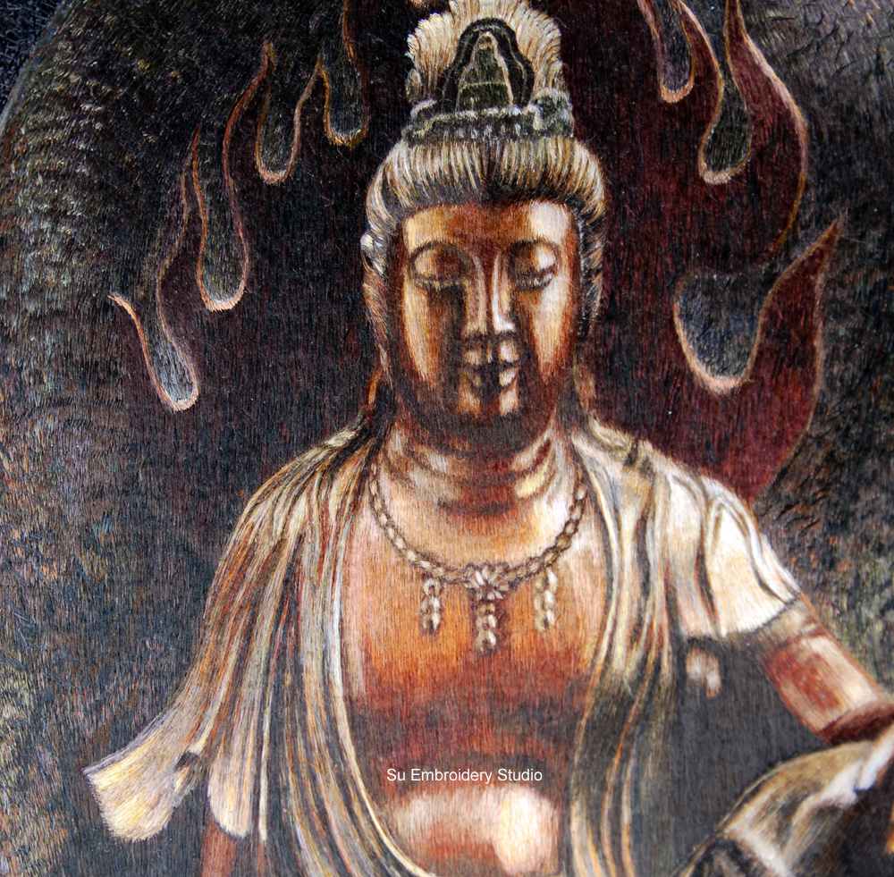 closeup of silk embroidery 'guanyin sitting on lotus'